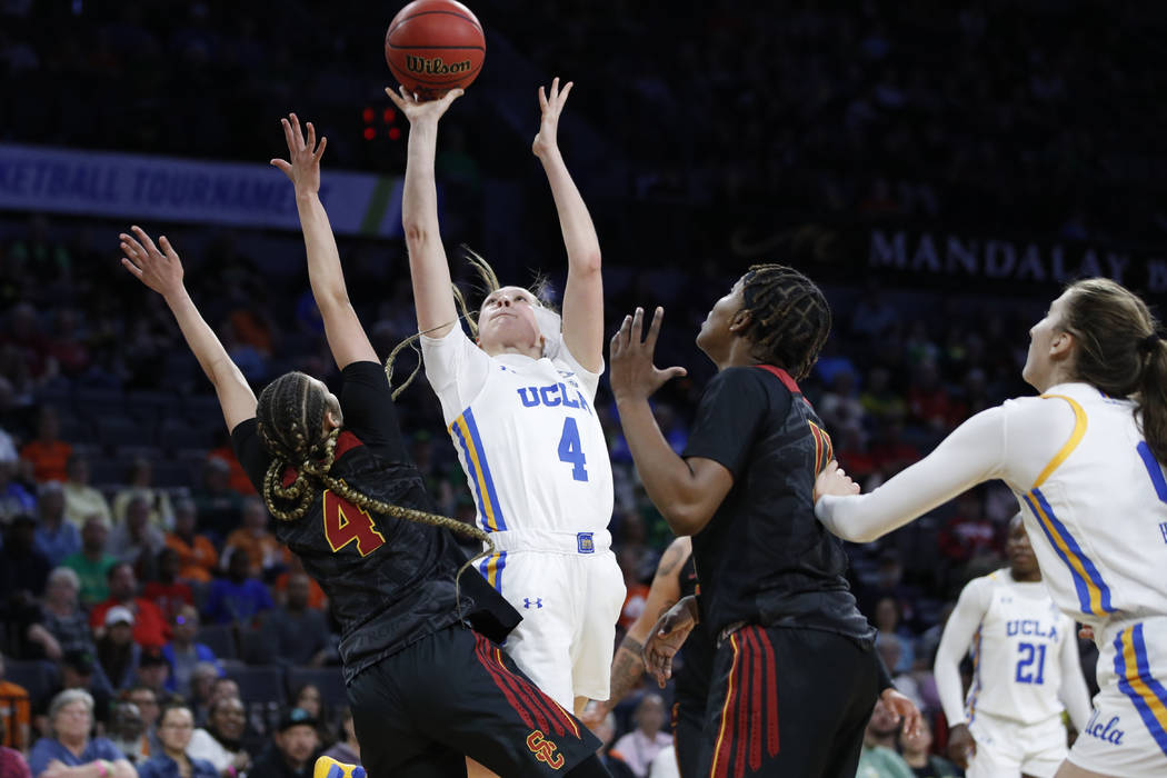 UCLA's Lindsey Corsaro shoots over Southern California's Endyia Rogers, left, during the second ...