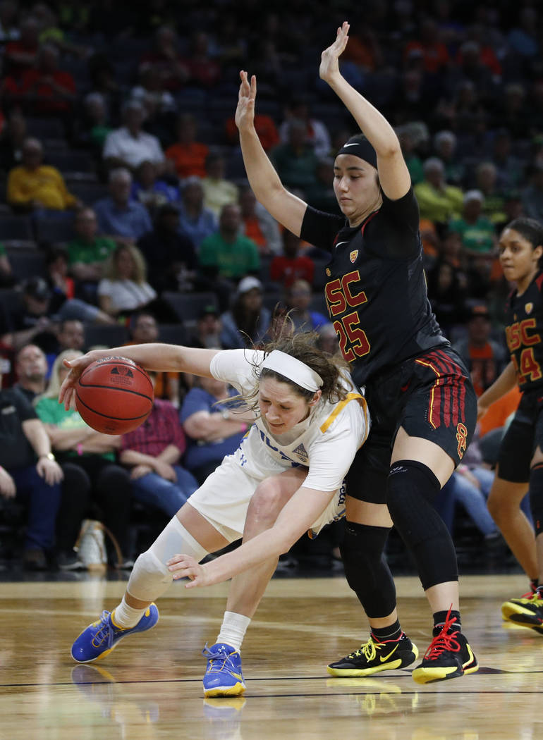 UCLA's Lindsey Corsaro (4) drives around Southern California's Alyson Miura (25) during the sec ...