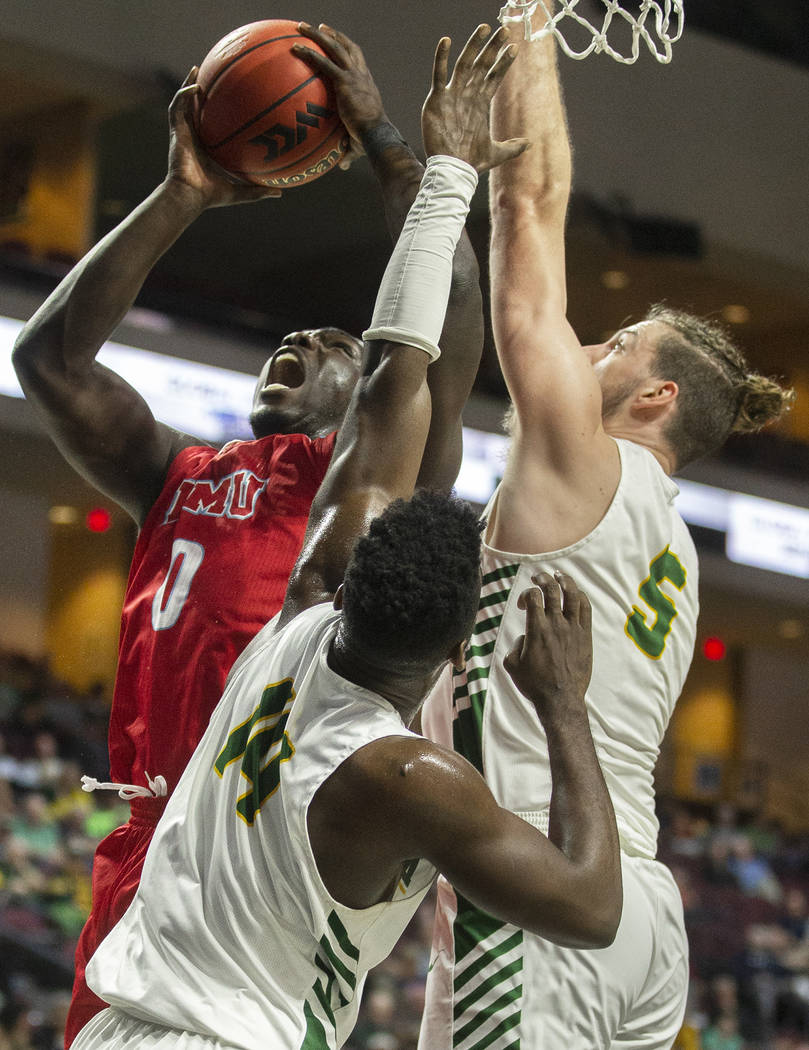 Loyola Marymount Lions guard Eli Scott (0) drives past San Francisco Dons guard Charles Minlend ...