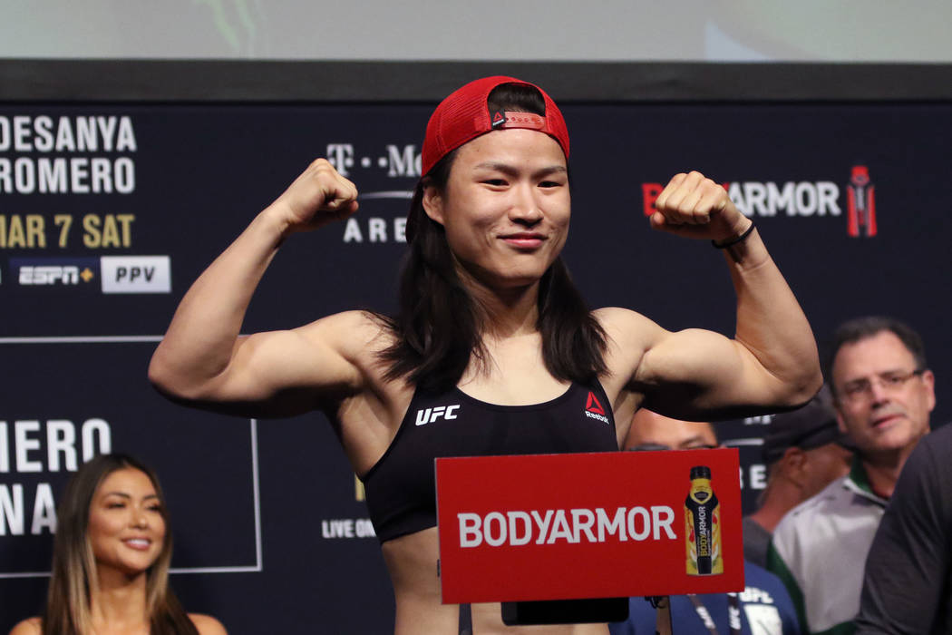 UFC strawweight champion Zhang Weili poses on the scale during the UFC 248 ceremonial weigh-ins ...