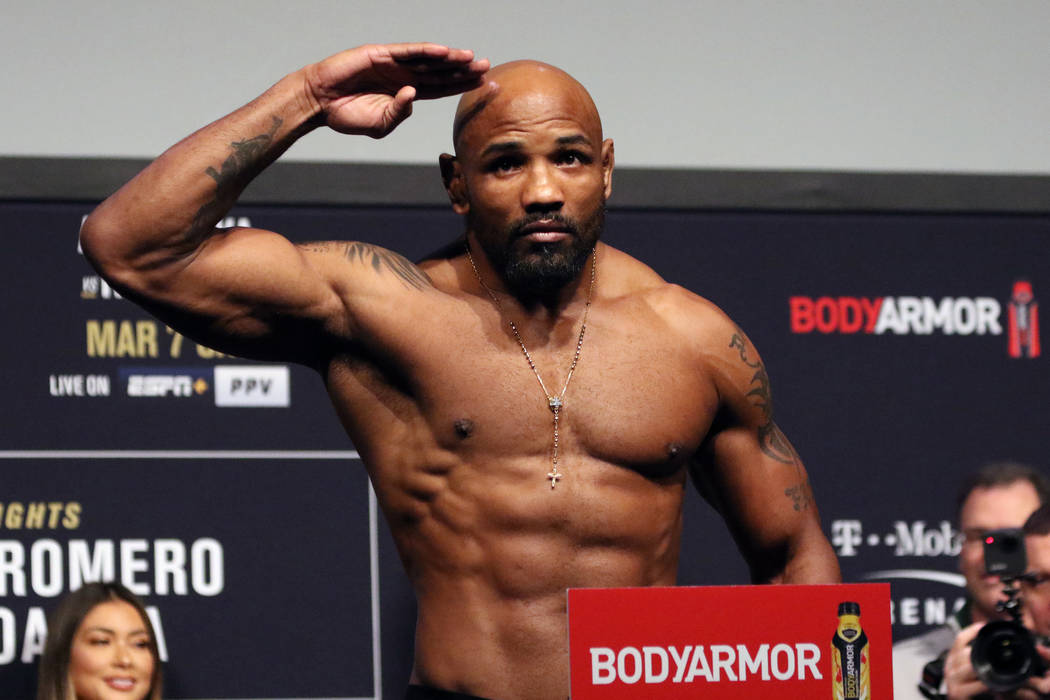 UFC middleweight Yoel Romero poses on the scale during the UFC 248 ceremonial weigh-ins at the ...