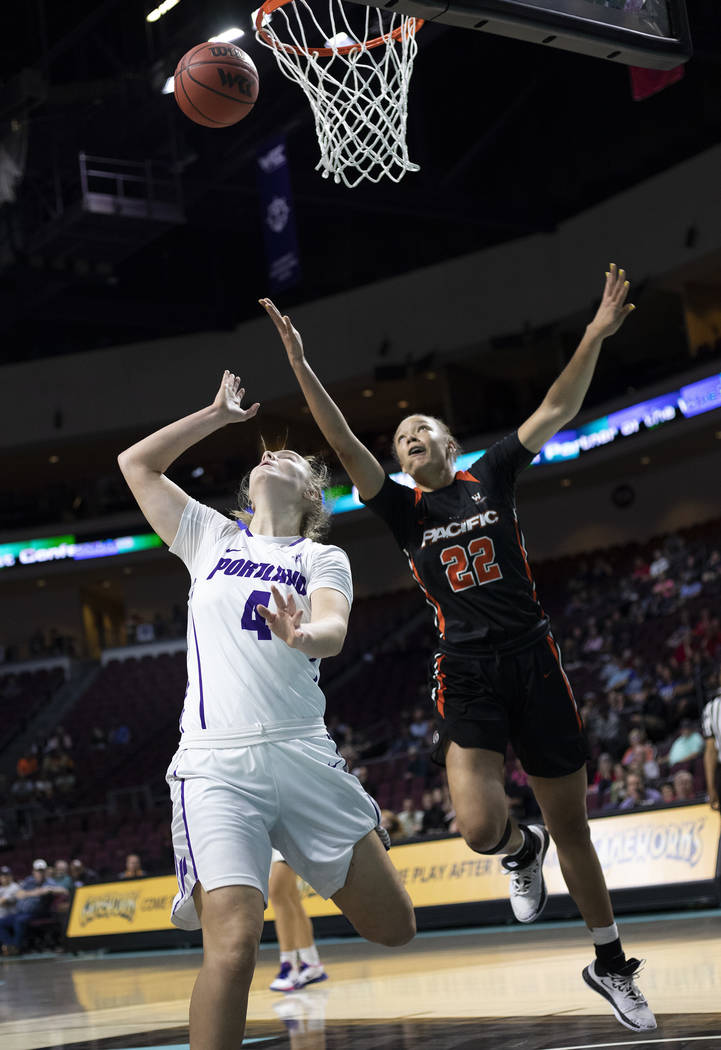 University of Portland's forward Keeley Frawley (4) watches her team's point near the basket as ...