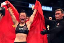 Women's Strawweight Weili Zhang celebrates her win on a decision over Joanna Jedrzejczyk during ...