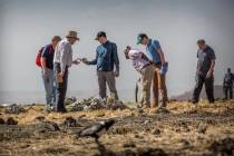 FILE - In this Tuesday, March 12, 2019 file photo, foreign investigators examine wreckage at th ...
