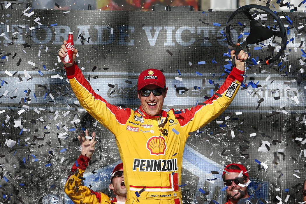 Driver Joey Logano celebrates in Victory Lane after winning a NASCAR Cup Series auto race at Ph ...