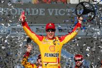 Driver Joey Logano celebrates in Victory Lane after winning a NASCAR Cup Series auto race at Ph ...