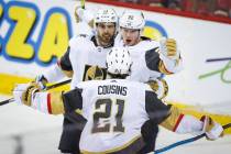 Vegas Golden Knights' Nick Holden, right, celebrates his goal with teammates Brandon Pirri, lef ...