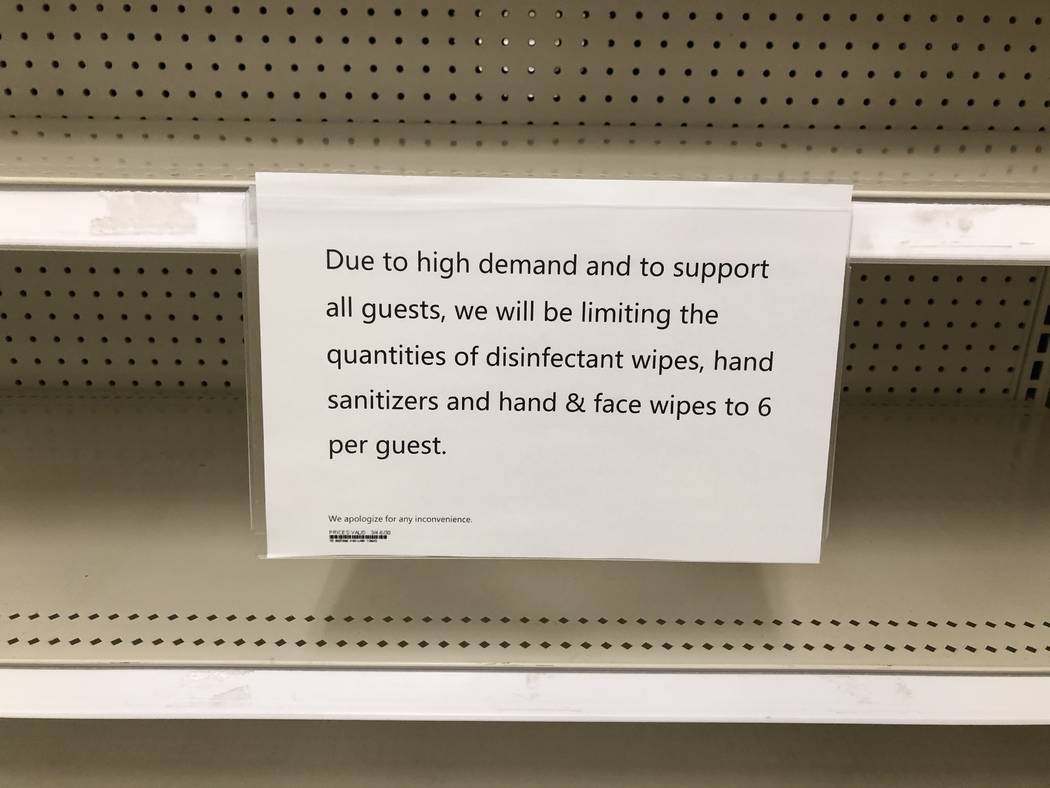 A sign about limiting quantities of certain items is seen at Target at 350 West Lake Mead Parkw ...
