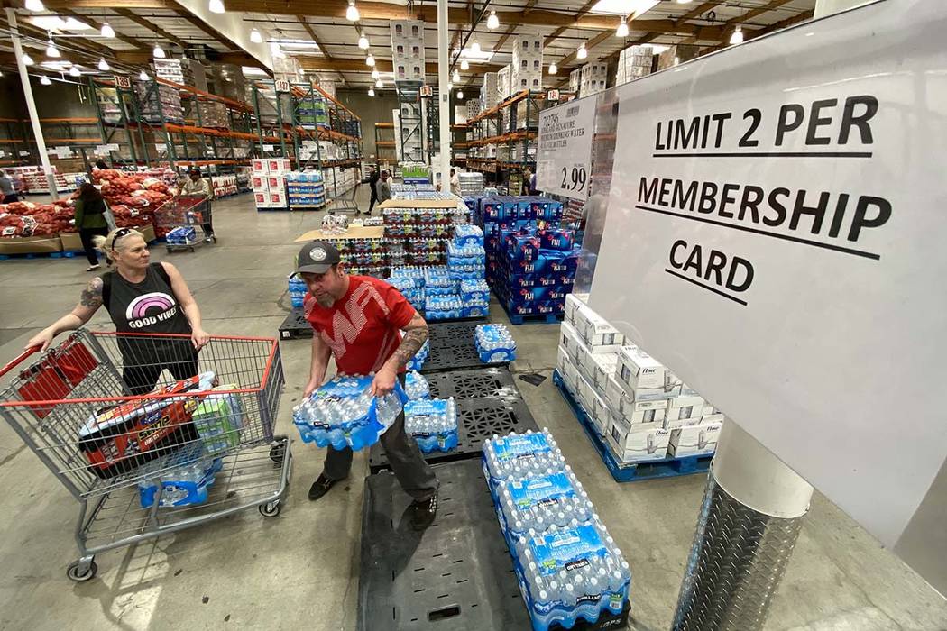 Shoppers stock up on bottled water at the Costco Business Center on Martin Luther King Boulevar ...