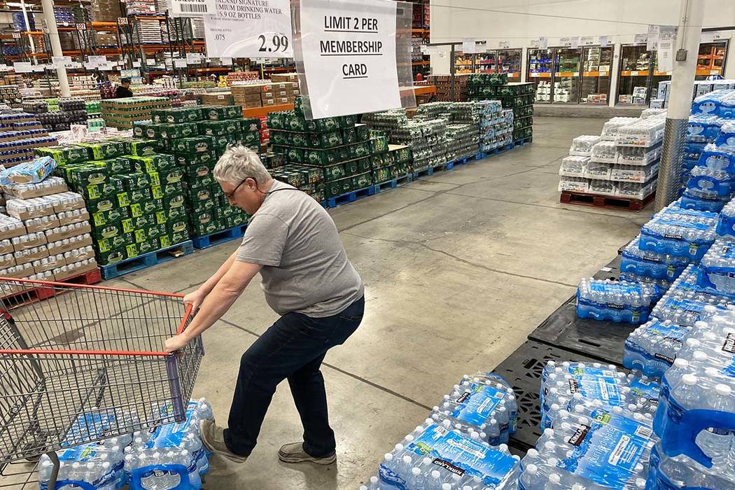 Shoppers stock up on bottled water at the Costco Business Center on