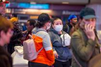 Passengers Sherry Carter, left, and Kimberly Thompson of Virginia wear face masks while awaitin ...