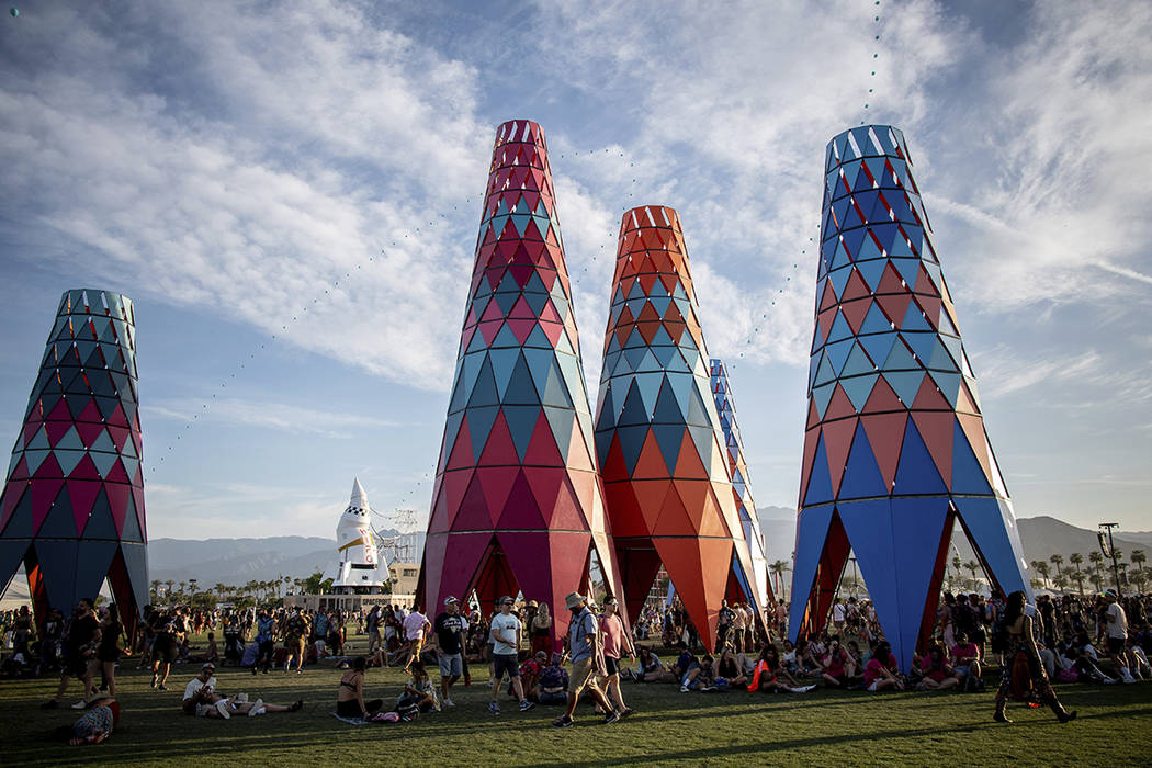 Festivalgoers attend the Coachella Music & Arts Festival at the Empire Polo Club on Sunday, Apr ...