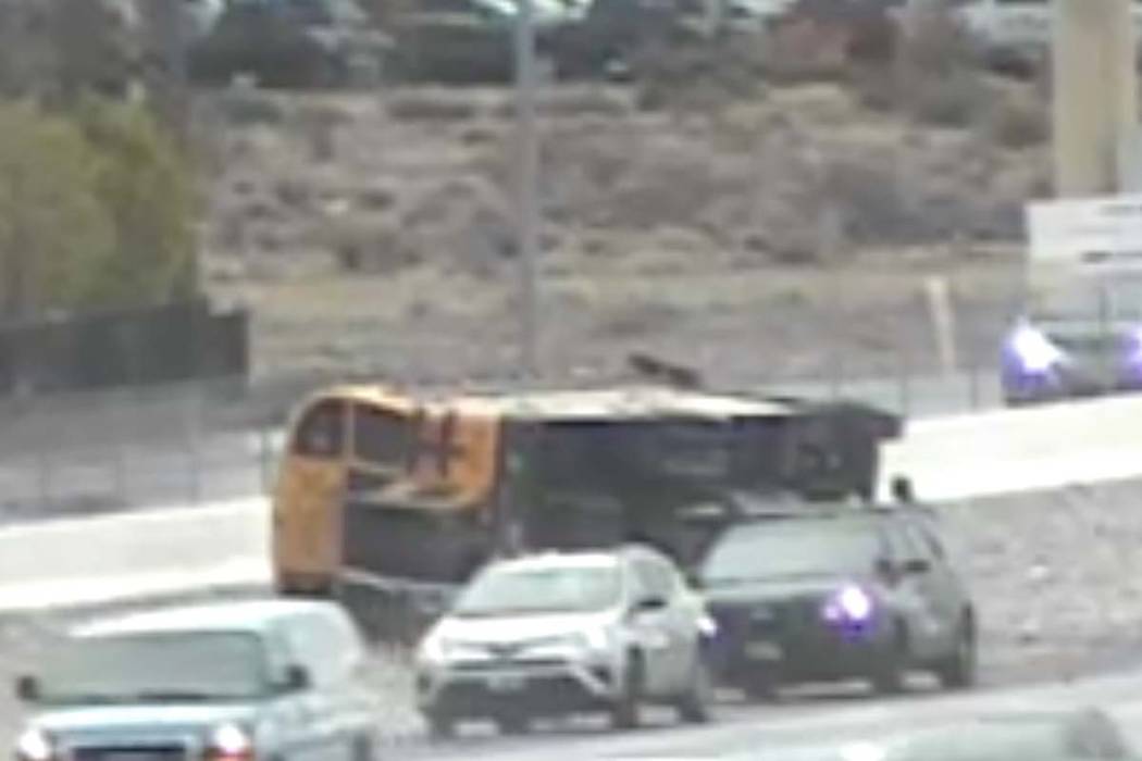 A Clark County School District bus sits on its side on Tuesday, March 10, 2020. (RTC cameras)