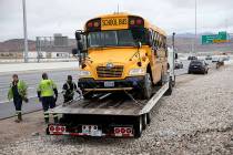Clark County School District police, Nevada Highway Patrol and tow truck operators prepare to r ...
