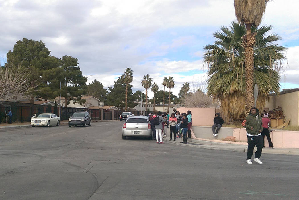 Damonea Hull's friends and family gather to grieve hours after police pronounced the victim dea ...