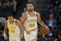 Golden State Warriors guard Stephen Curry (30) against the Toronto Raptors during an NBA basket ...