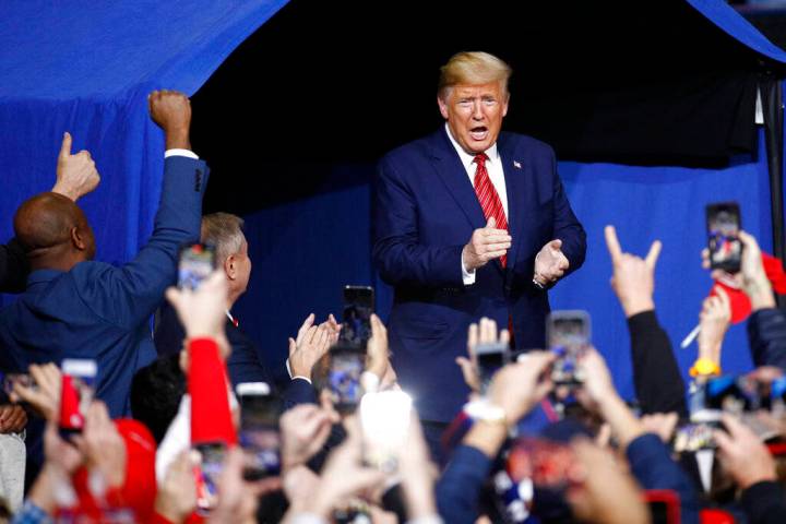 President Donald Trump walks onstage at a campaign rally, Friday, Feb. 28, 2020, in North Charl ...