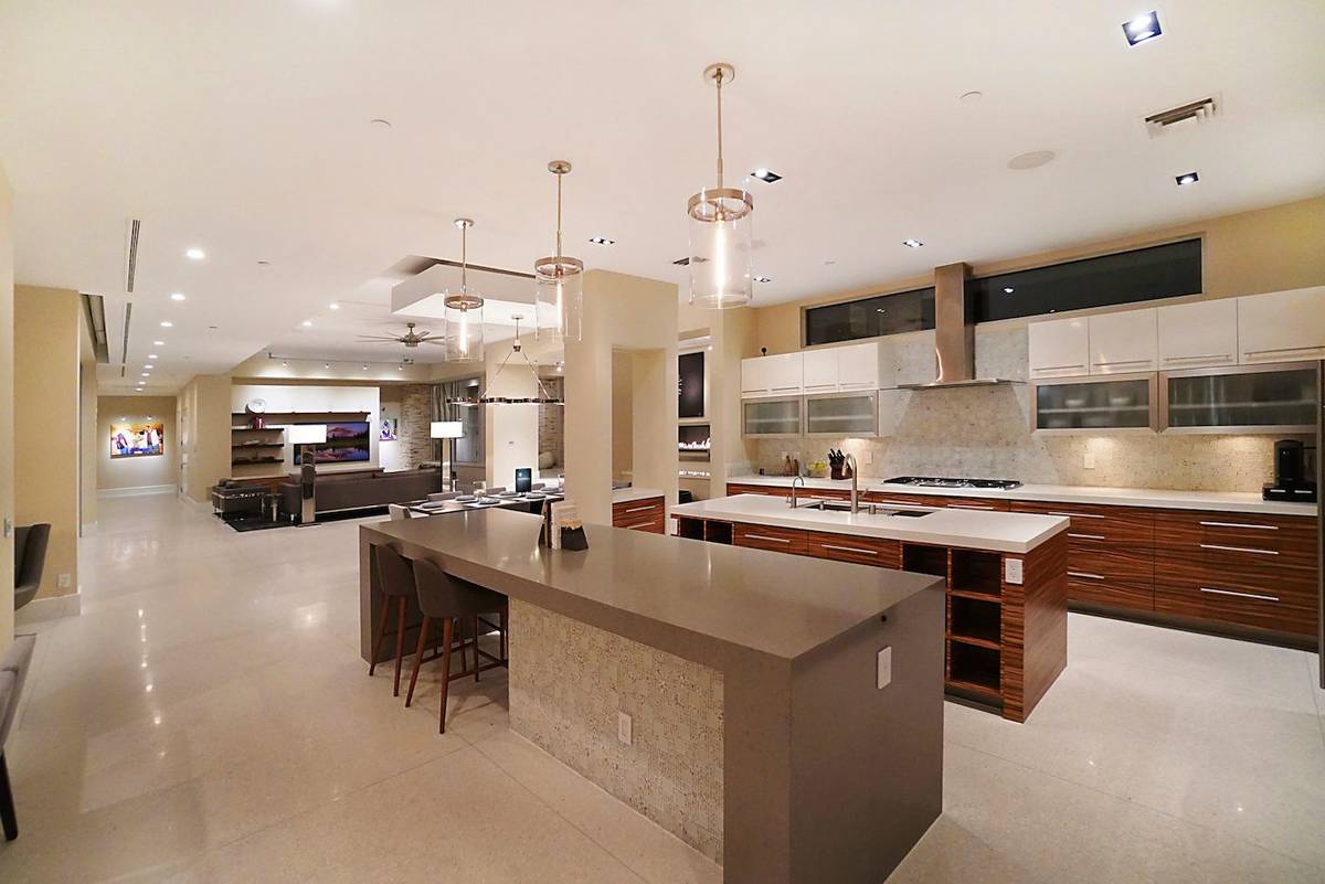 The kitchen features custom European-styled African Zebrawood cabinetry. (Luxurious Real Estate)