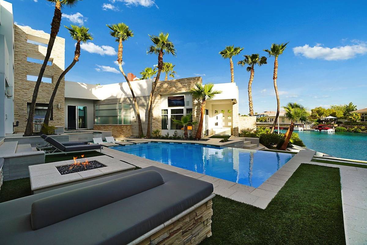 The home's backyard has a resort-style infinity-edge pool with Baja shelf and intimate entertai ...