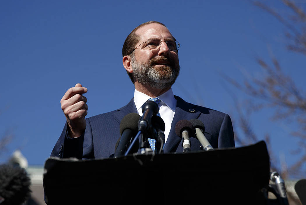 Health and Human Services Secretary Alex Azar speaks to media outside the West Wing of the Whit ...
