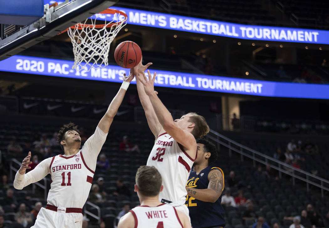 Stanford's forward Jaiden Delaire (11) and forward Lukas Kisunas (32) jump to block a shot by U ...