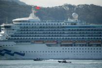 A pair of boats escort the Grand Princess cruise ship through San Francisco Bay Monday, March 9 ...