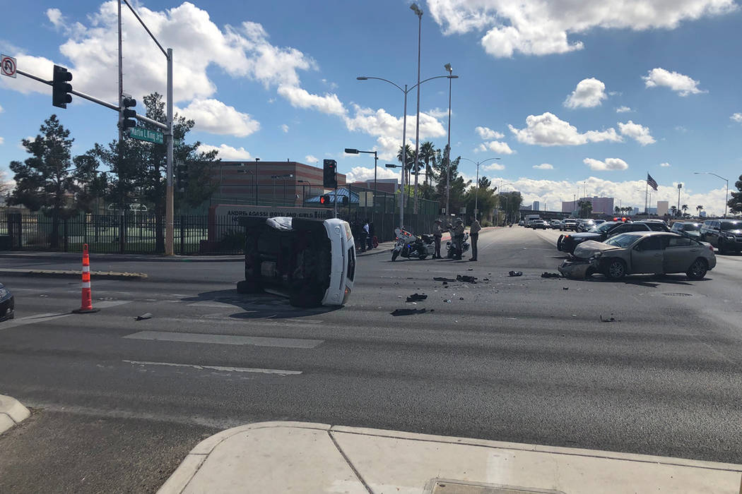 Police investigate a crash Wednesday, March 11, 2020, at the intersection of West Washington Av ...