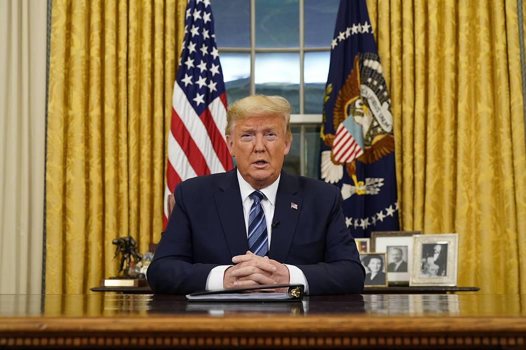 President Donald Trump speaks in an addresses to the nation from the Oval Office at the White H ...