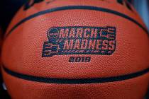 A basketball with a logo is seen before a first round men's college basketball game between Min ...