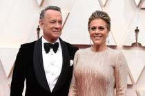 FILE - In this Feb. 9, 2020 file photo, Tom Hanks, left, and Rita Wilson arrive at the Oscars a ...