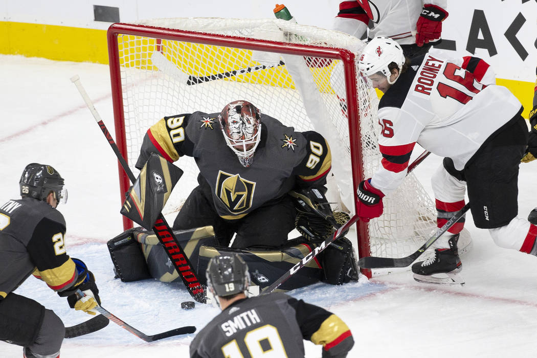 Vegas Golden Knights goaltender Robin Lehner (90) makes a save against New Jersey Devils center ...