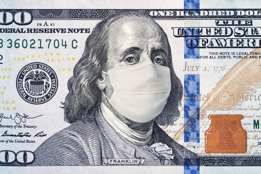 American President with a face mask against CoV infection. 100 dollar banknote. Coronavirus in ...