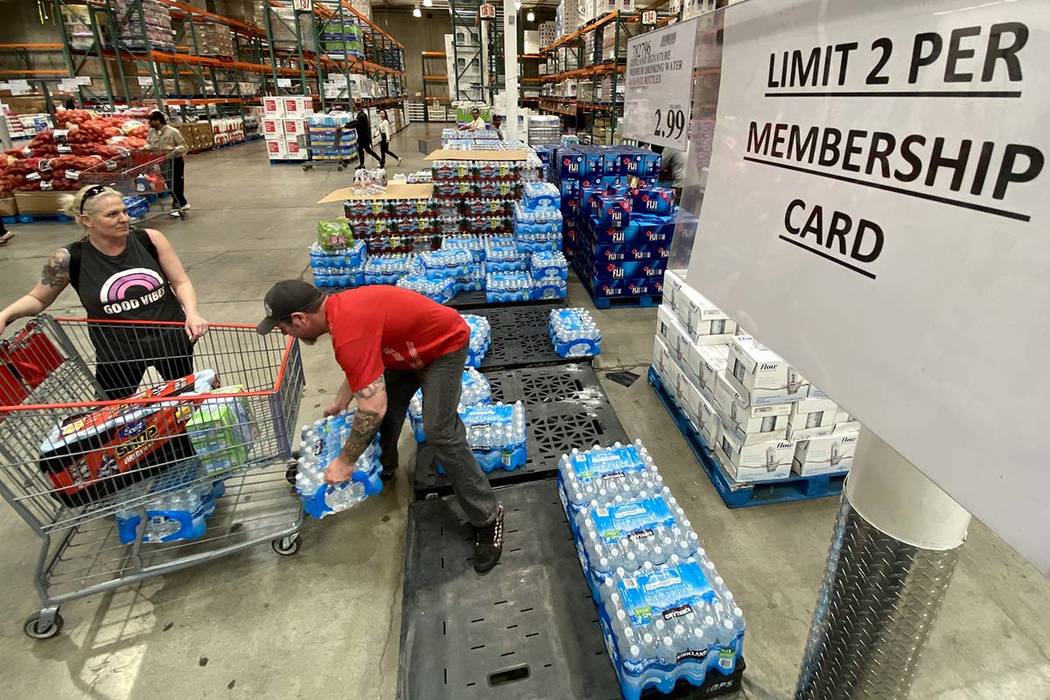 Shoppers, including Kami and Shawn Saunders of North Las Vegas, buy water at Costco at 222 S. M ...