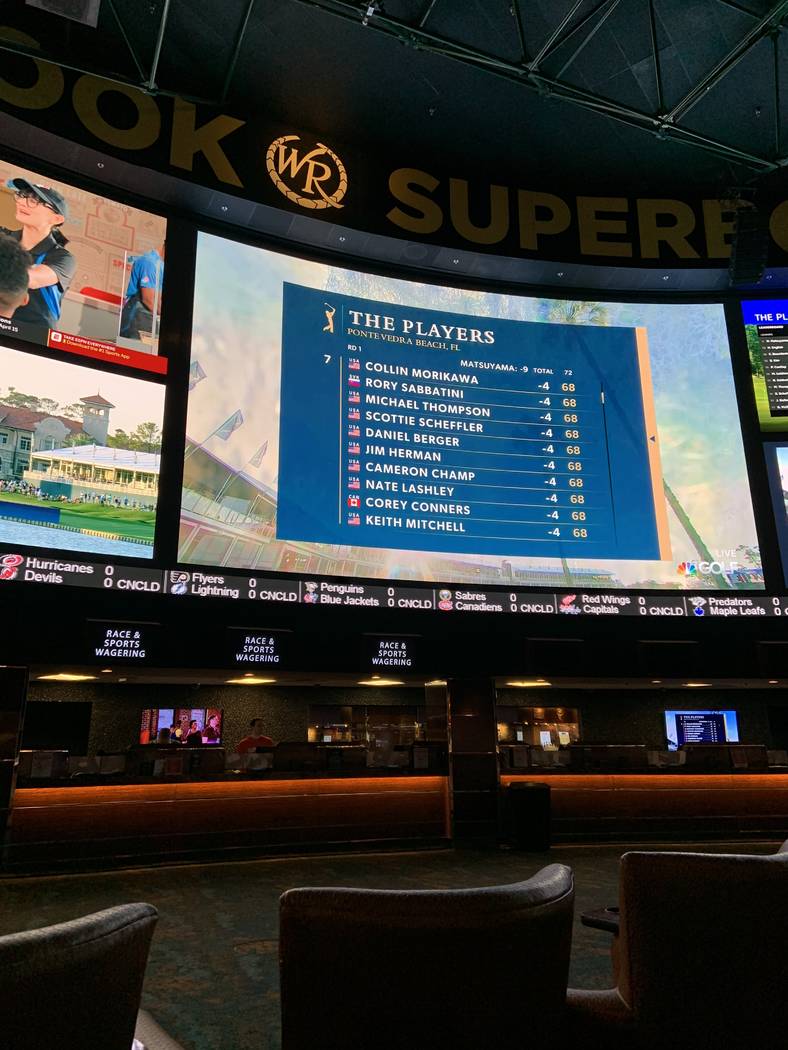 Coverage of The Players Championship is shown on the main screen at the Westgate sportsbook on ...