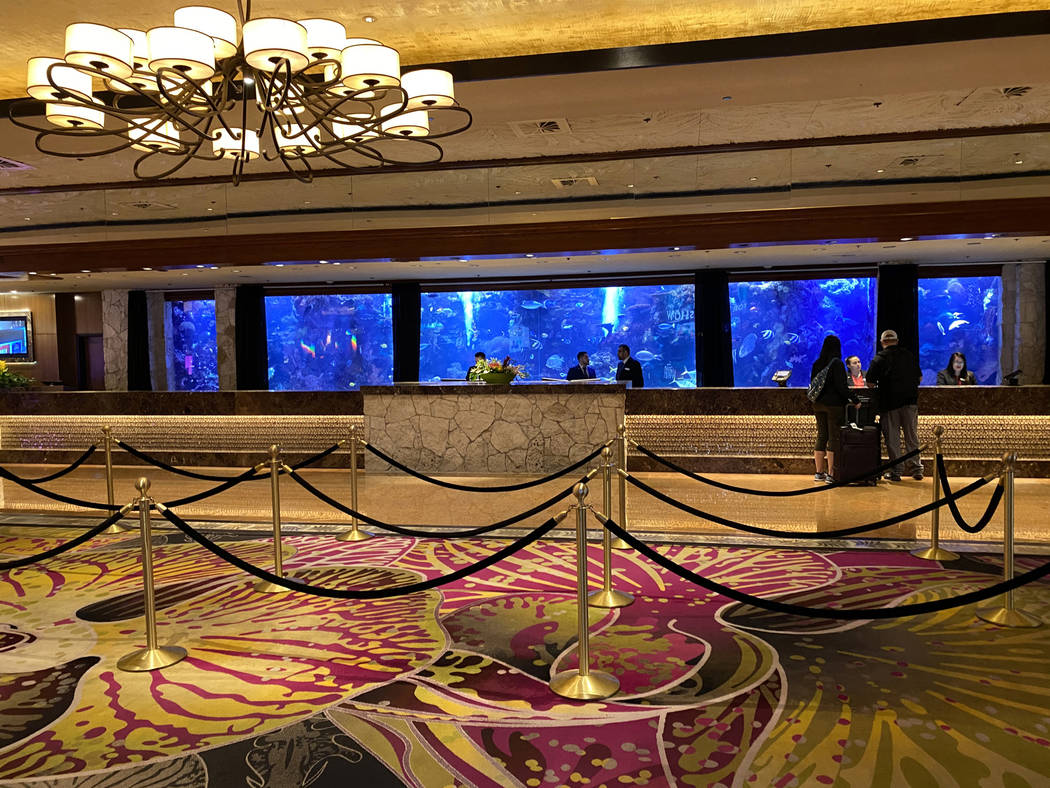The registration desk at The Mirage on the Strip in Las Vegas Thursday, March 12, 2020. (K.M. C ...