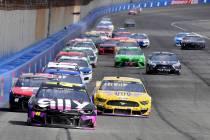 Jimmie Johnson (48) leads the field into Turn 3 during the second stage of a NASCAR Cup Series ...