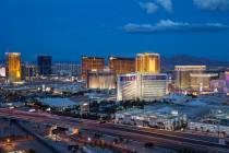 The Strip skyline lights up at dusk as seen from the VooDoo Lounge atop the Rio hotel-casino in ...