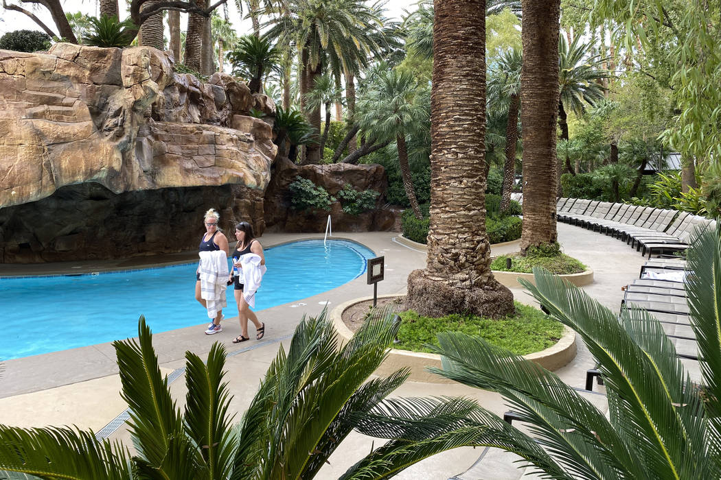 Guests walk along a pool at The Mirage on March 12, 2020, in Las Vegas. (K.M. Cannon/Las Vegas ...
