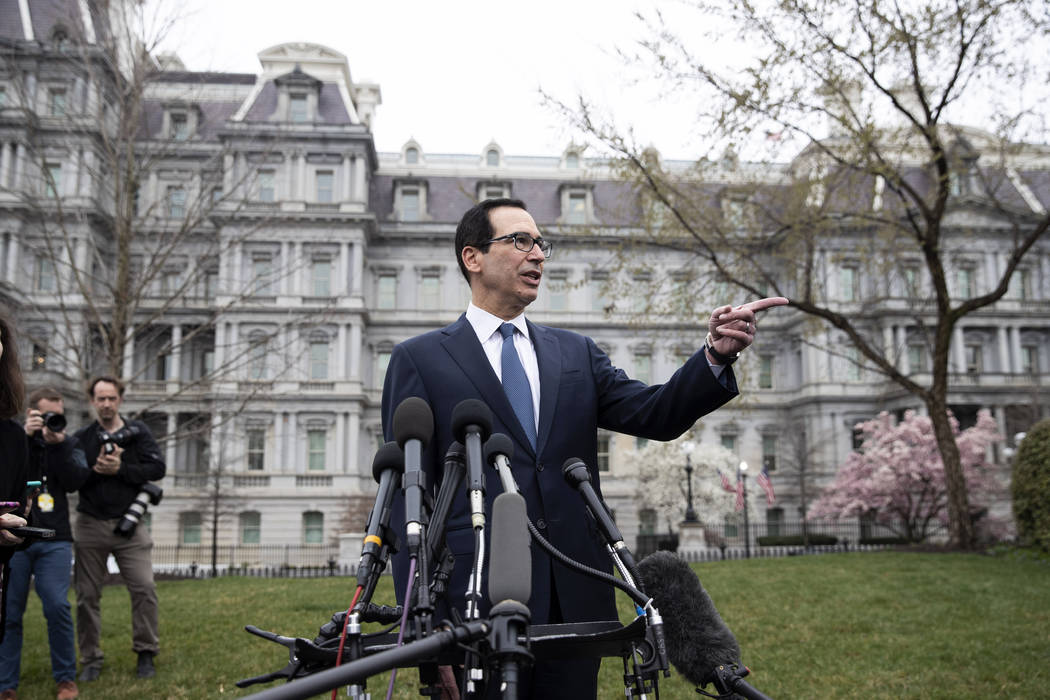 Treasury Secretary Steve Mnuchin speaks with reporters about the effects from the coronavirus, ...