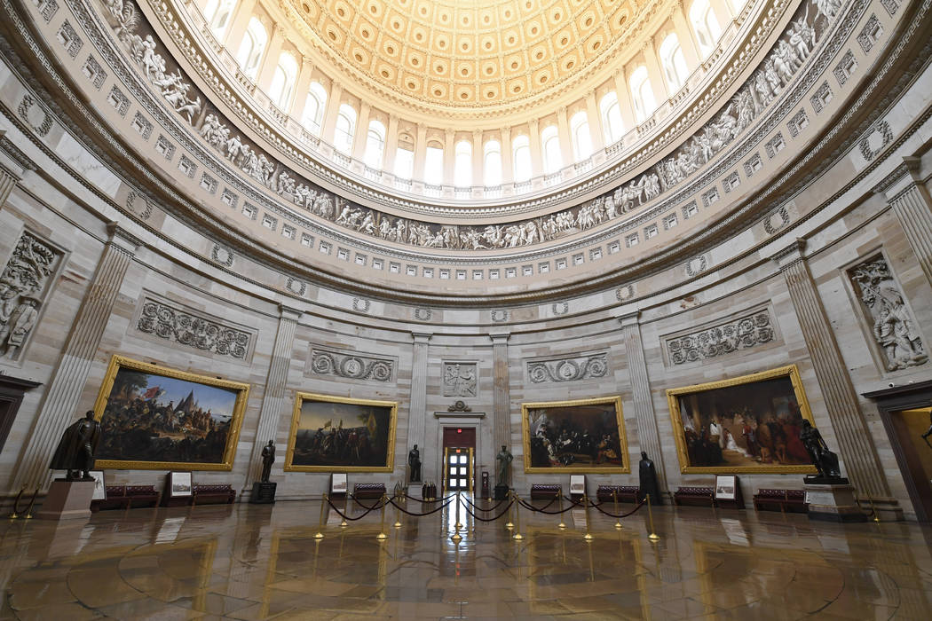 There are no visitors touring the Capitol Rotunda on Capitol Hill in Washington, Friday, March ...