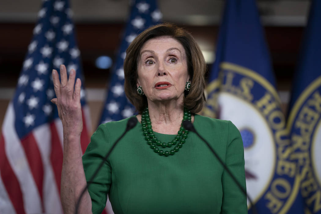 Speaker of the House Nancy Pelosi, D-Calif., updates reporters as lawmakers continue work on a ...