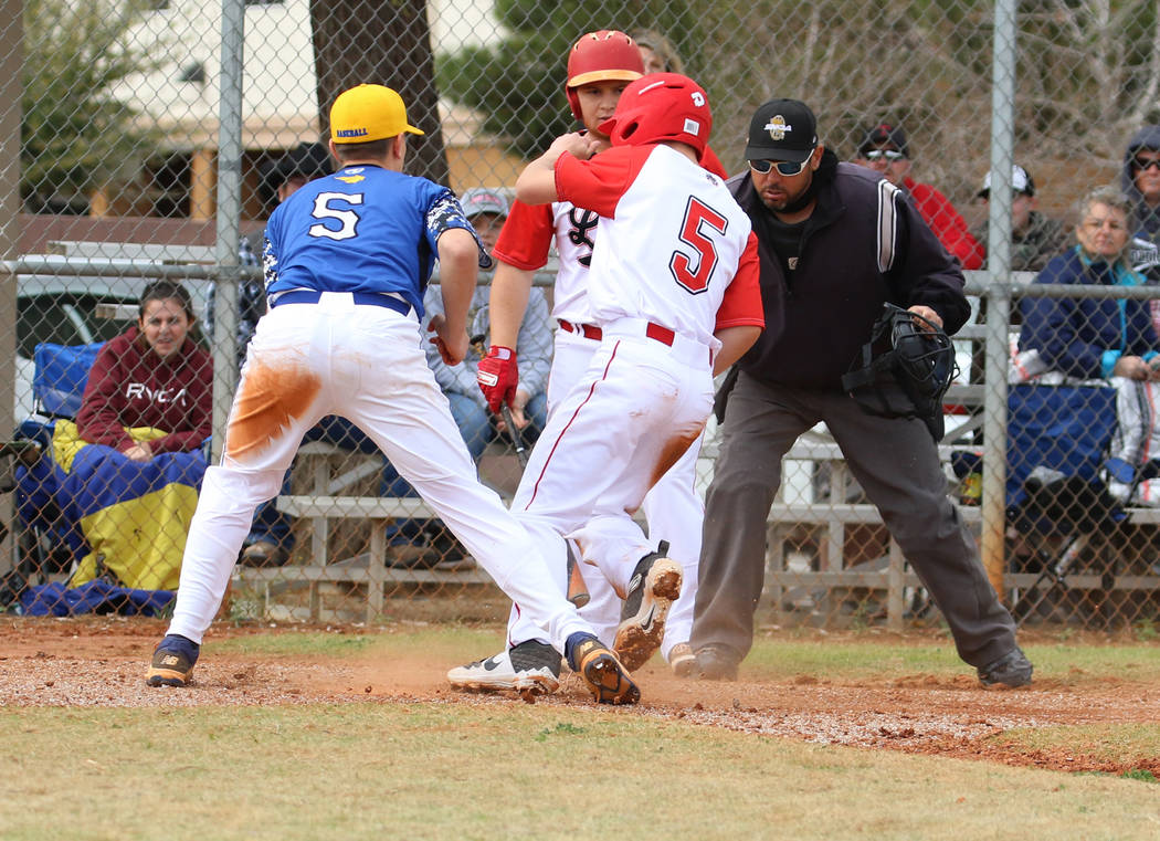 Lincoln County High's Cody Howard (5) comes home safe as Pahranagat Valley High School's Presto ...