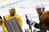 Golden Knights right wing Ryan Reaves (75) and defenseman Nate Schmidt (88) share a laugh while ...
