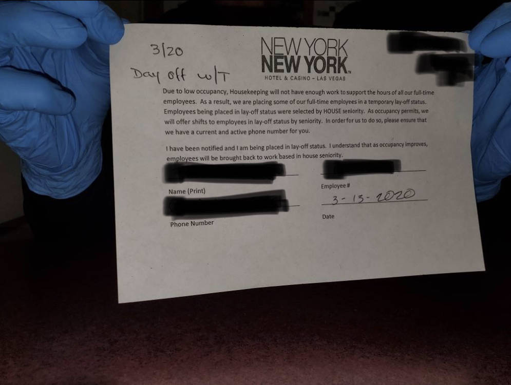A New York-New York employee holds a termination letter received Friday, March 13.