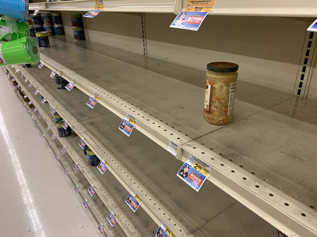 Empty shelves are seen at the Vons at 7405 S Durango Drive in Las Vegas, Friday, March 13, 2020 ...