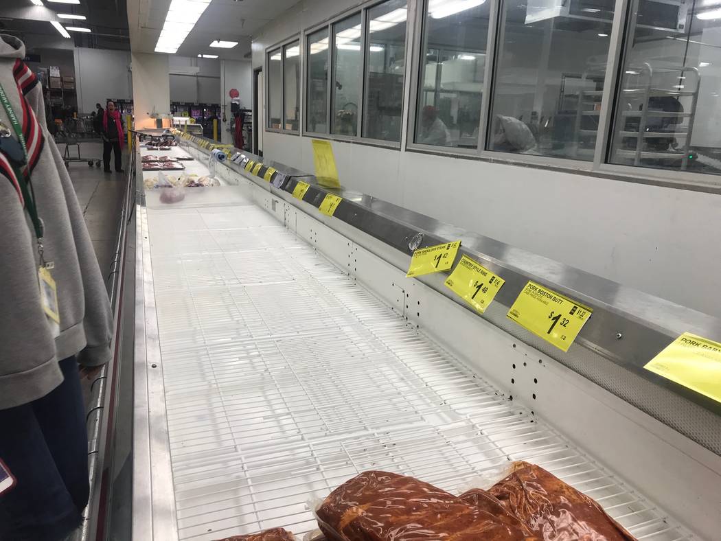 Empty shelves are seen at Sam's Club at 5101 S. Pecos Road in Las Vegas, Friday, March 13, 2020 ...