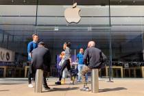 Staff at the Apple Store in downtown Summerlin alert customers that the store is closed on Satu ...