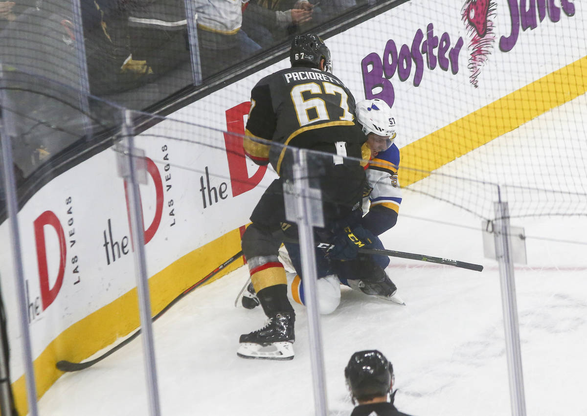 Golden Knights' Max Pacioretty (67) tries to fight St. Louis Blues' David Perron (57) during th ...