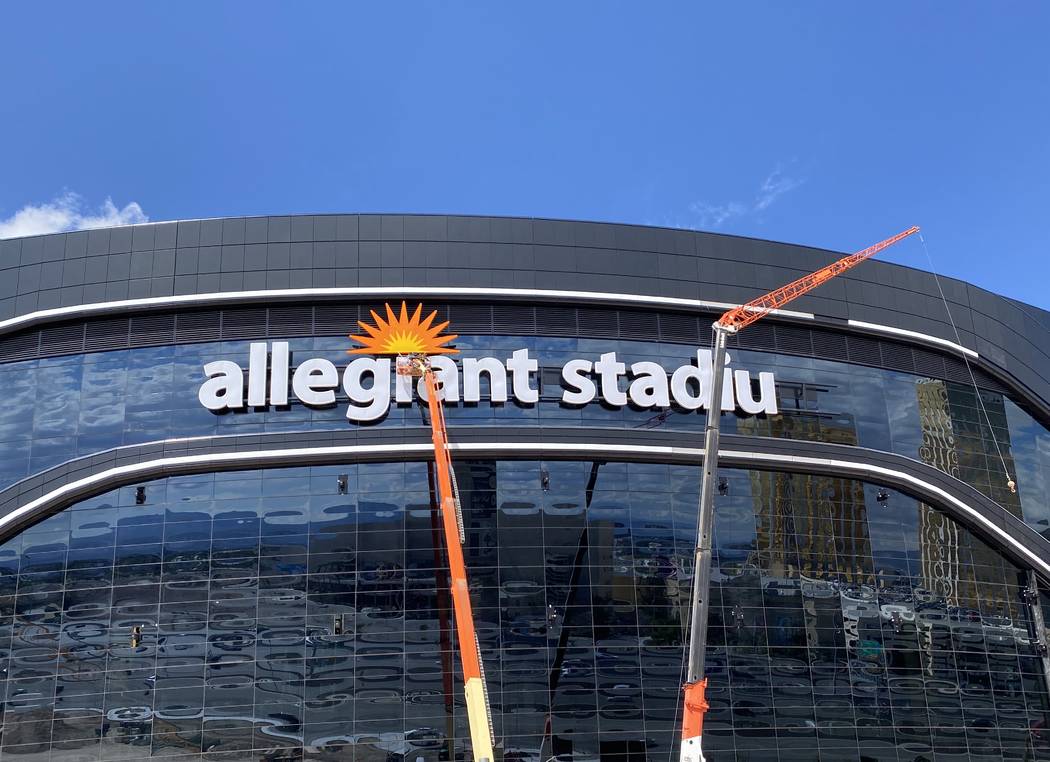 Yesco crews removed the "m" on the Allegiant Stadium sign Sunday, March 15, 2020, to readjust i ...