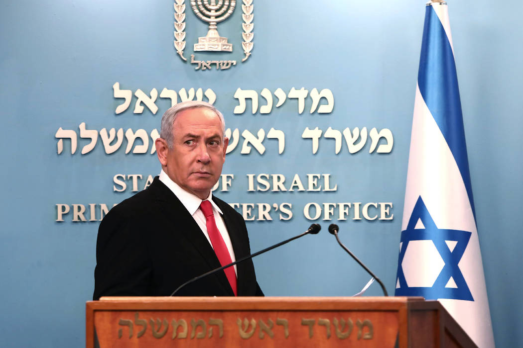 Prime Minister Benjamin Netanyahu approaches the podium to speak from his Jerusalem office on S ...
